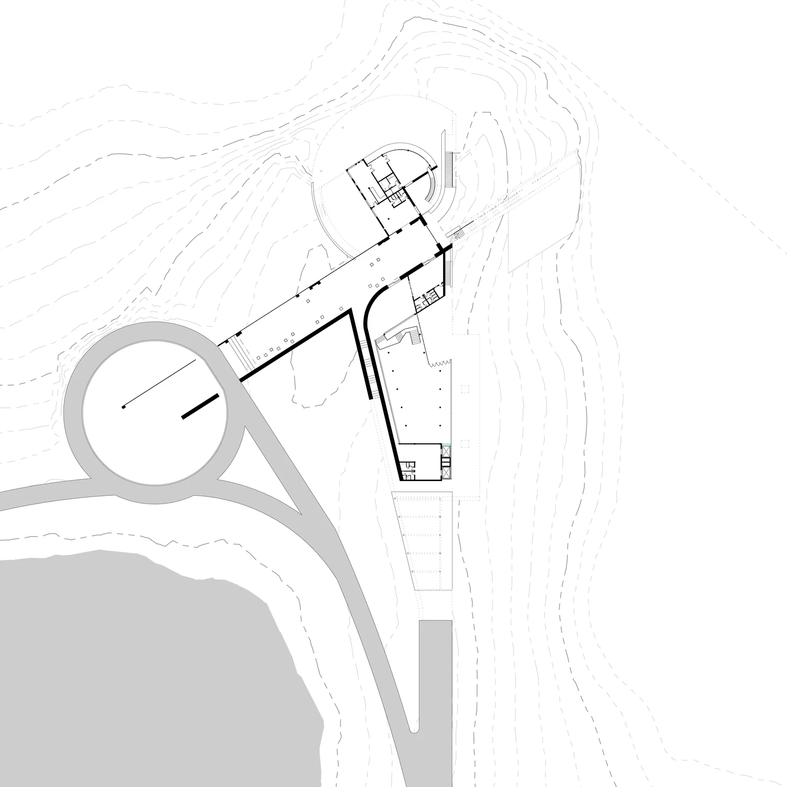Ground floor plan: the arrival roundabout and drive meeting the entry wing, with the public hall behind.