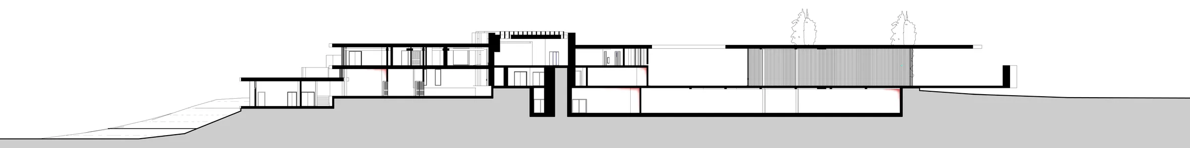 Long section through the residence wing: two storeys stepping down with the ground under a louvred roof.